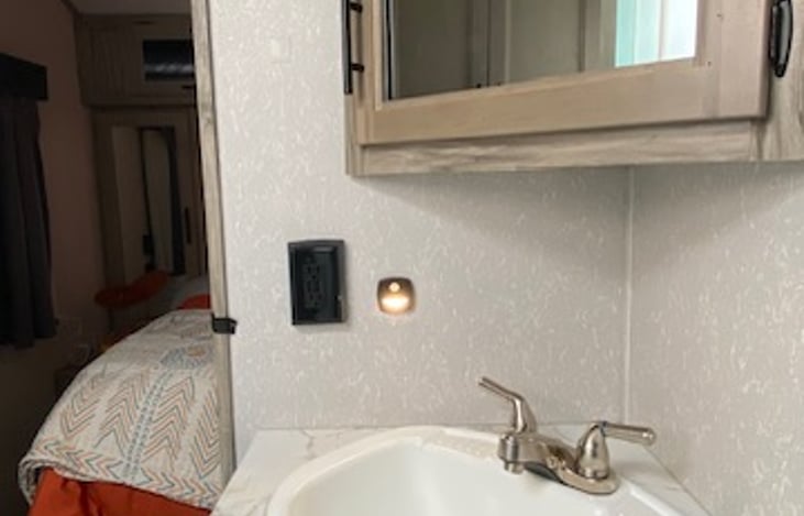 motion sensing night light and GFCI receptacle with reset button.