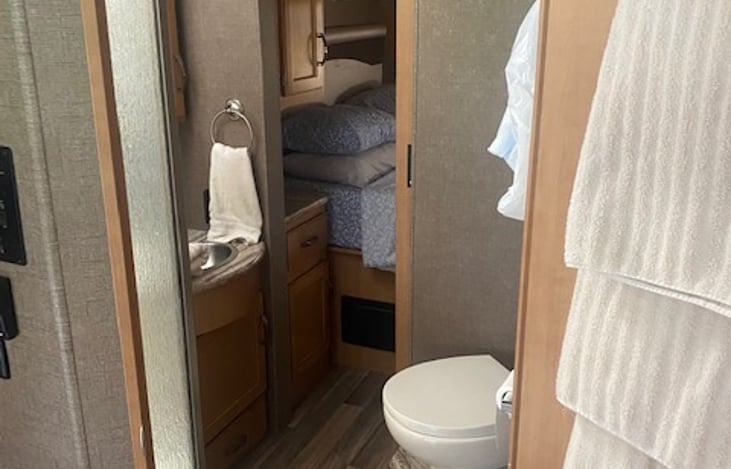 Bathroom is accessible from the kitchen or the master bedroom.  Water pressure is decent.