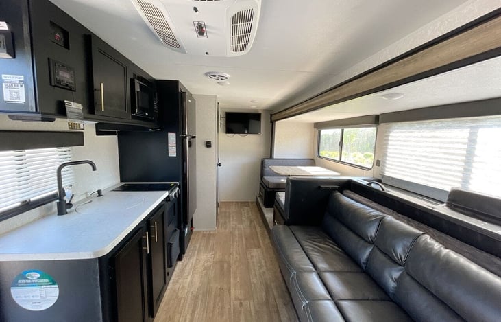 Kitchen, Sofa, Dinette and TV.