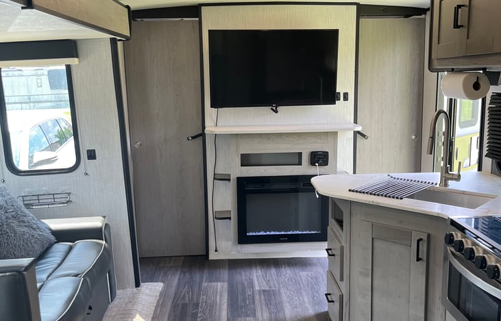 Living room area with kitchen