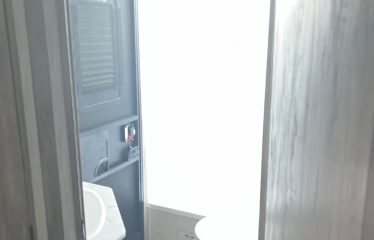 Full bathroom will a small tub.