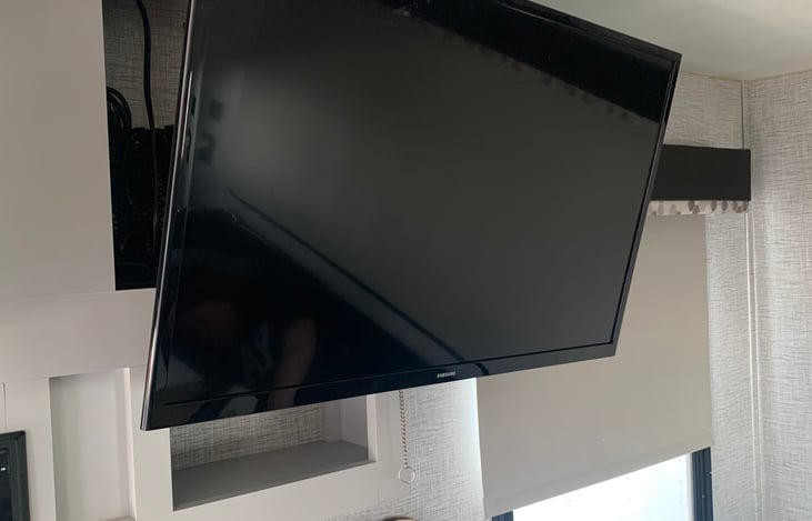 TV is mounted on a swivel mount.