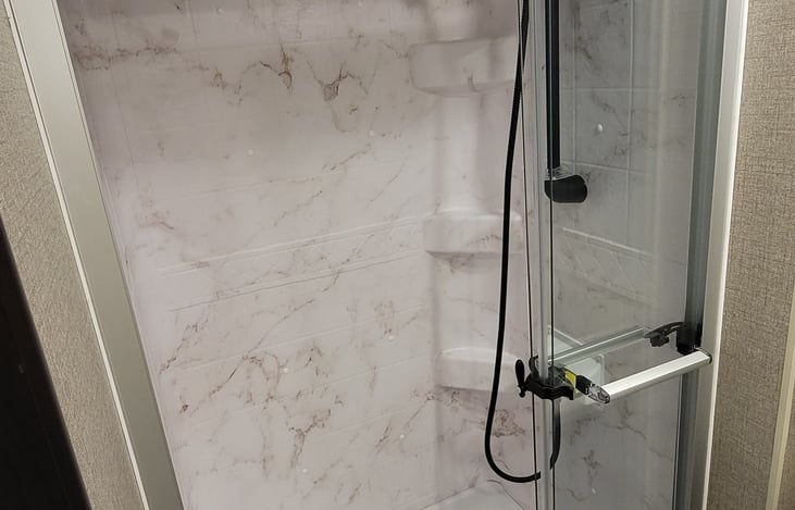 Master Bathroom full shower with ceiling fan and shower caddy.  Set yourself up and relax!
