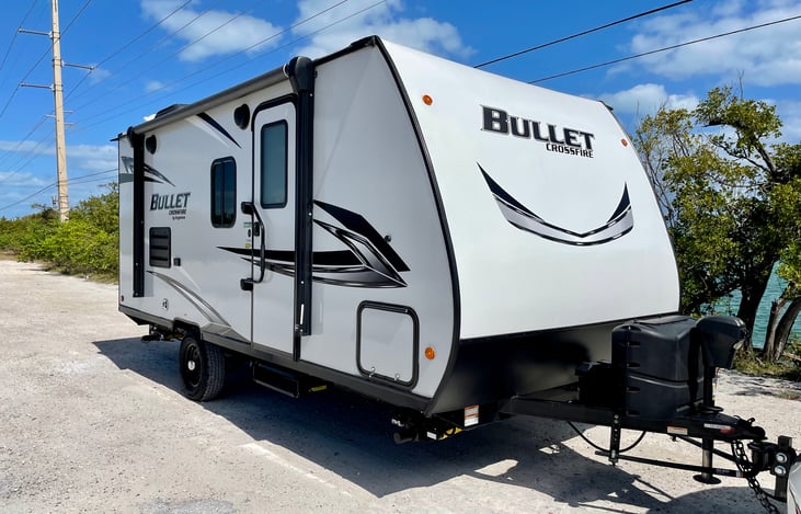 Power Tongue Jack, 2 LP Gas Tanks  and 11” Awning with LED lights and exterior speakers