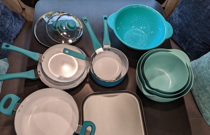 Provided pots, pans, bowls, colander, and lids
