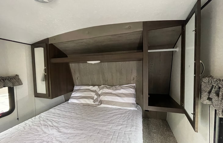 Two closets that fit standard size hangers.