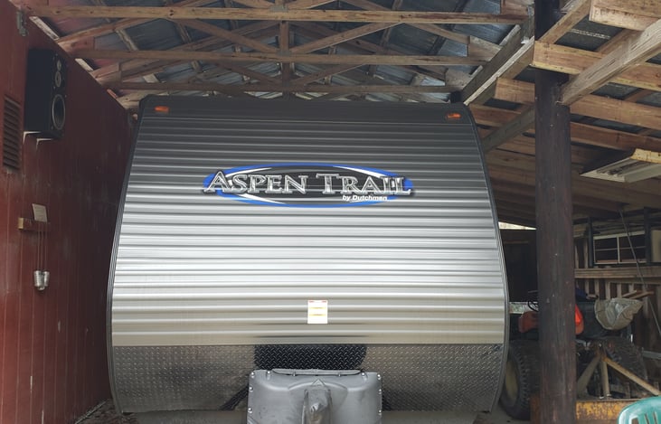 Front of camper and the propane tanks.