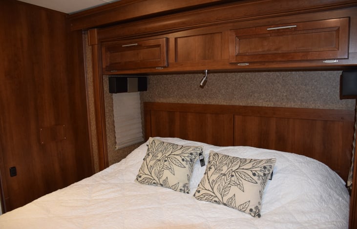 King size bed with extra storage overhead
