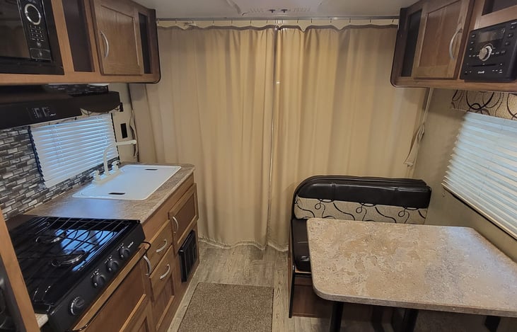 Curtains closed for bed area.