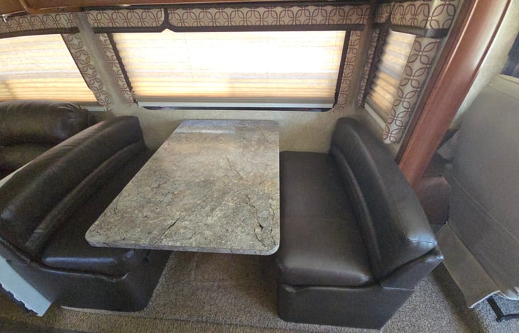 Dining table. Converts to bed best for two smaller people/ children. A fold-out mattress to lay on top of the cushions at bedtime makes this quite comfortable. New dining room table seats