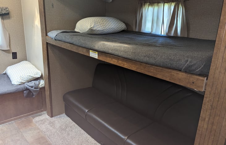 Upper bunk can be stowed up for use of couch. Couch jack knifes into bed as well as trundle bed under couch.