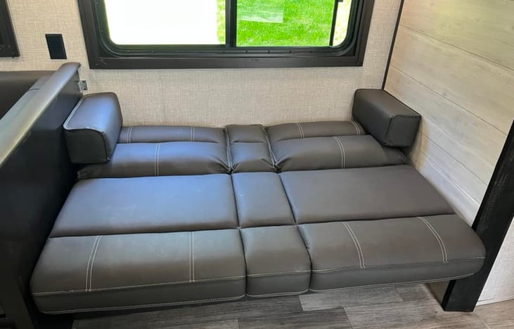 Jack-knife sofa flipped down. Can be used as a bed for a child up to about preteen age.