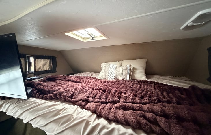 Overhead full size bed with tv