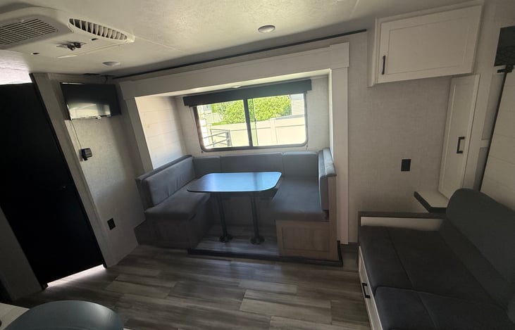Dining table, window, (all in the slide), TV on wall- can use Netflix, Amazon Prime if you're at an RV site with internet.