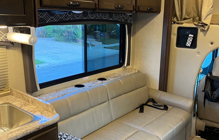 Couch with seatbelts, converts to bed.