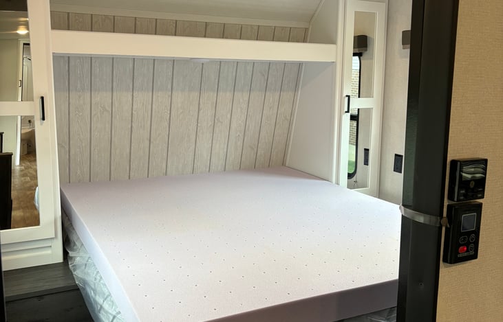 Queen size bed with 4" memory foam topper