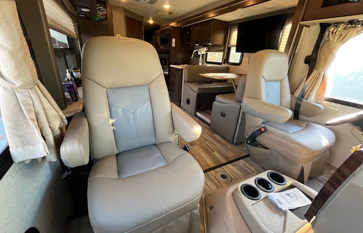 Reupholstered captain chairs