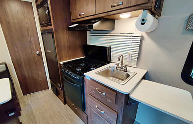 Kitchen with full oven and counter extender