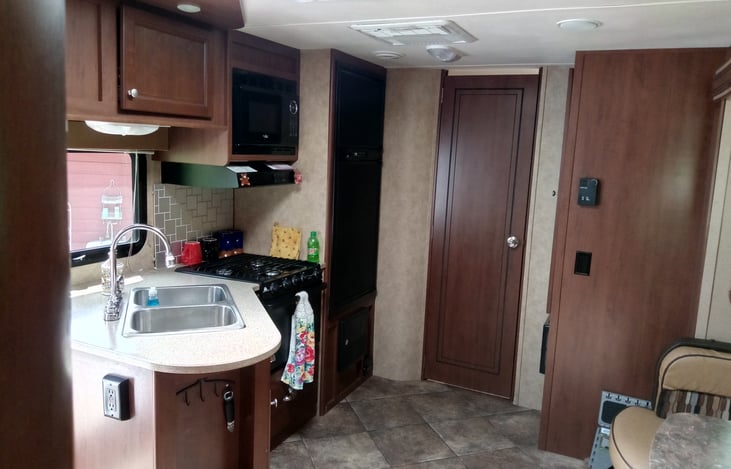 Kitchen, bathroom door, pantry.