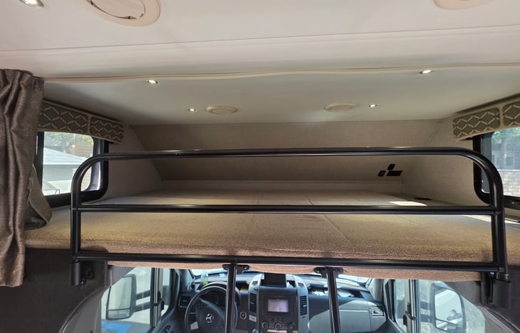 Spacious over-cab bunk that comfortably fits two kids (up to about 90 lbs.  one adult up to 190 lbs. T a built -in ladder for easy climbing and a safety bar to keep sleepers secure and cozy