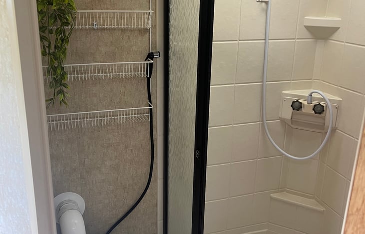 Bathroom with compost toilet and a working shower