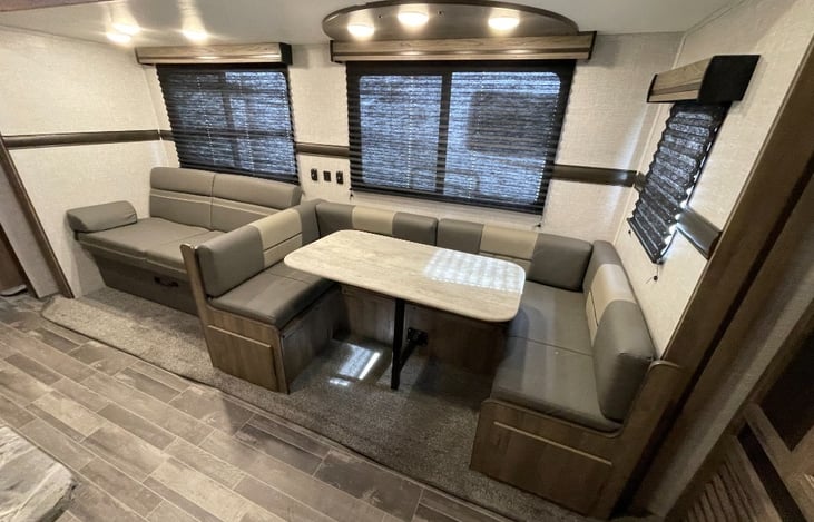 Fold Out Sofa and U-Shaped Dinning which both turn into beds.