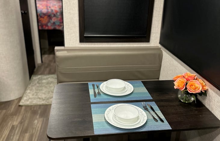 Booth dining for four doubles as a workspace or converts to a child's bed.