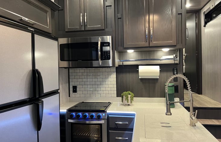 Microwave, stove, oven and complimentary Keurig coffee maker.