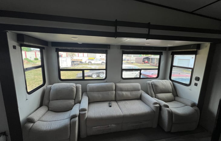 Two rocker/recliners, pull out couch in living room.