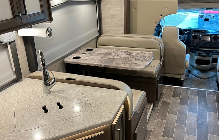 dinnette transforms to bed and has a charging station for going down the road