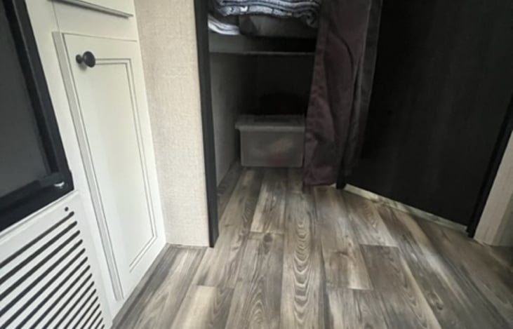 Storage under the bunks that run the length of the bunks. Bottom bunk has 3” memory foam mattress topper.