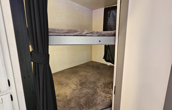 Full size bunk beds at the rear of the camper