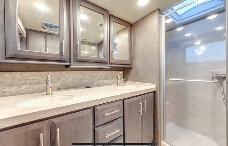 Master Bathroom, full bath, toilet, 2 sinks extra height counters, vanity mirrors with storage and extra large shower with shower seat.