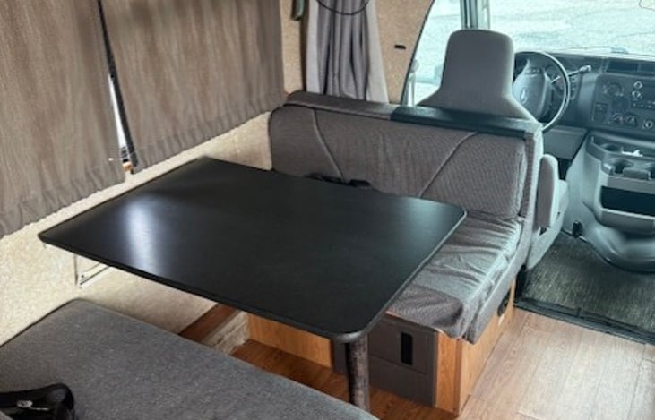 Convertible dinette facing forward with four seatbelts.  Has latch- type system for baby seats