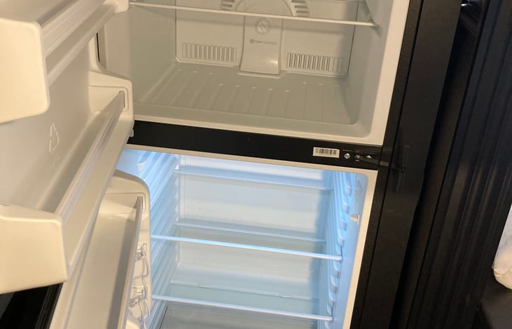 Inside of Jake's fridge and freezer.