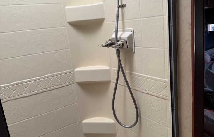 Shower has newly installed sliding shower door