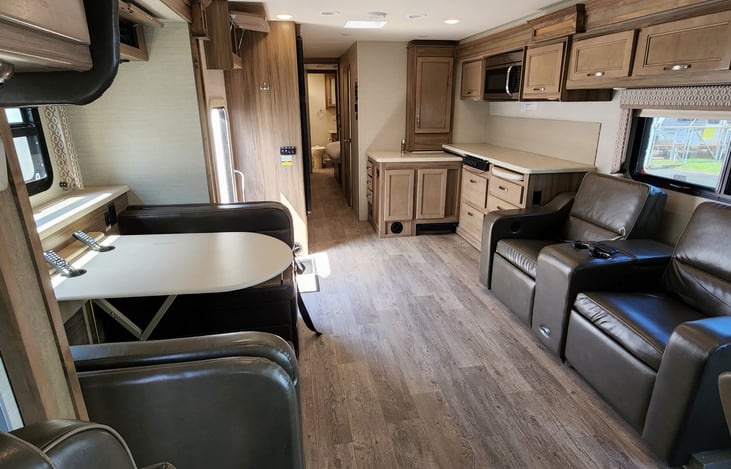 Automatic recliners face a hidden big screen tv