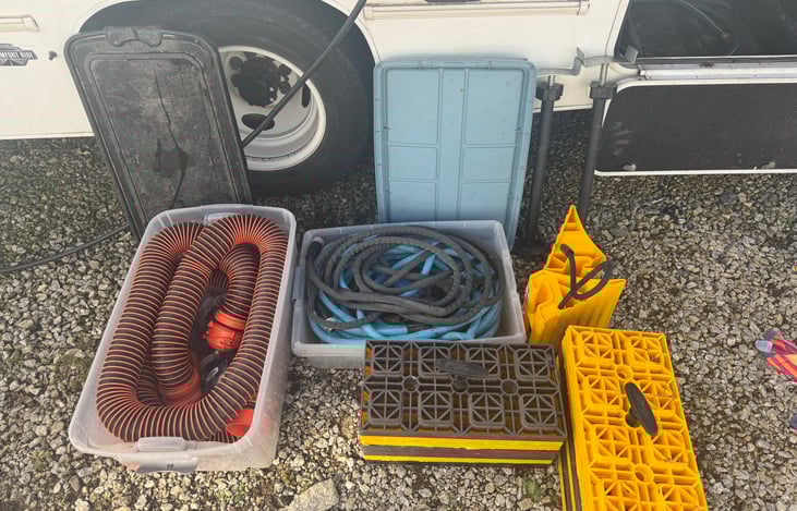 Sewer and water hoses, chock blocks, stabilizers