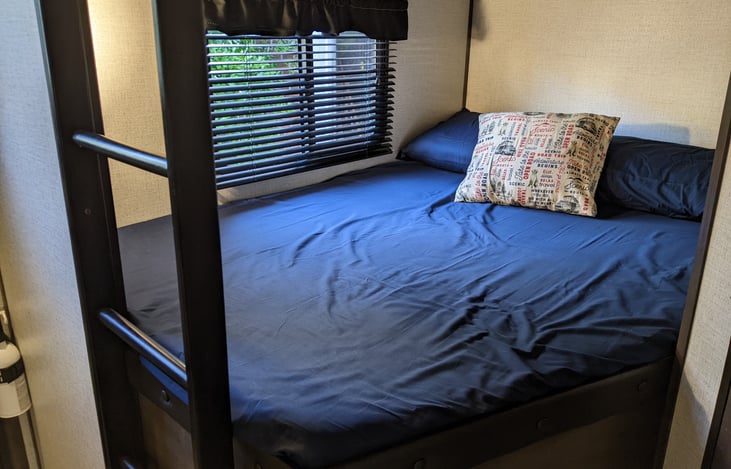 Spacious double bunk with window, bed light & USB charging port