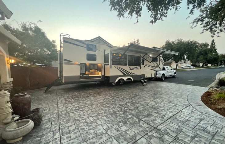 The outdoor kitchen provides a beverage refrigerator and a sink for washing and ease of cleaning. The griddle is perfect for convenience in outdoor grilling to feed the friends and family.