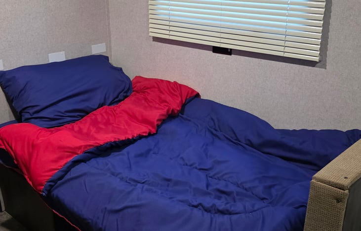 Bedding for the converted bed.