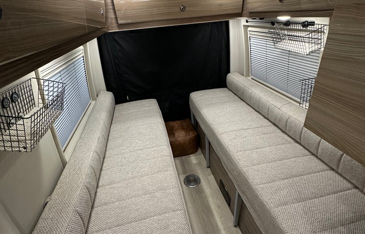 Bed made up into double benches.