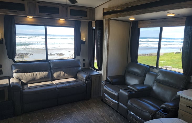 Living Room Couches. One turns into a sleeper sofa other two recline, have heat, armrest, cup holders and massagers