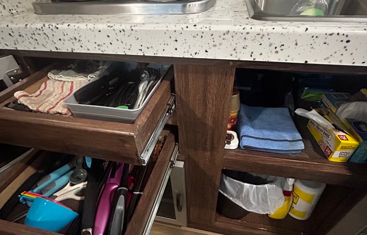 Drawers and cabinets stocked with utensils, towels, candle lighters, basic cleaning supplies and trash bags