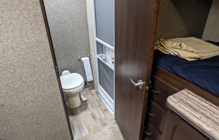Bunk room bathroom with outdoor access