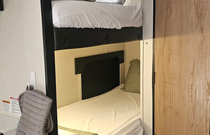 Twin Bunk Beds for the kids! Each bunk will have a fitted sheet, pillow, and comforter provided. Extra flat sheets are stored for your convenience.