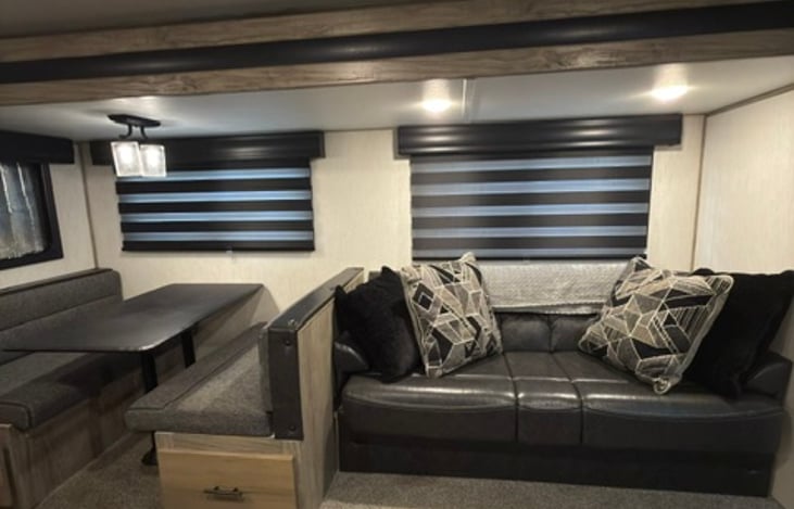 Table converts to a bed and the couch converts to a bed. Memory Foam included for both.