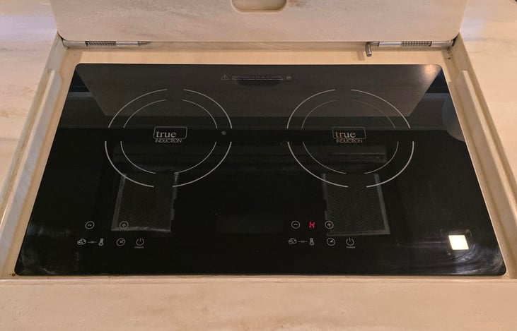 Two burner induction cooktop with cover