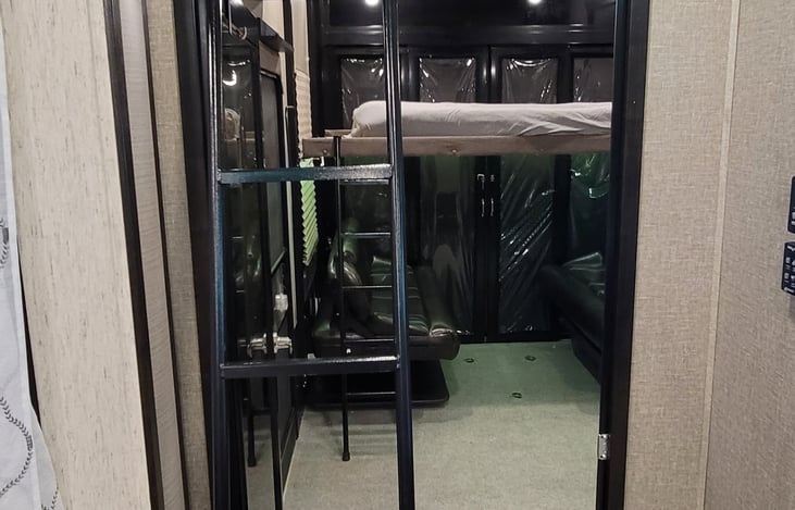 Entrance to garage with loft ladder