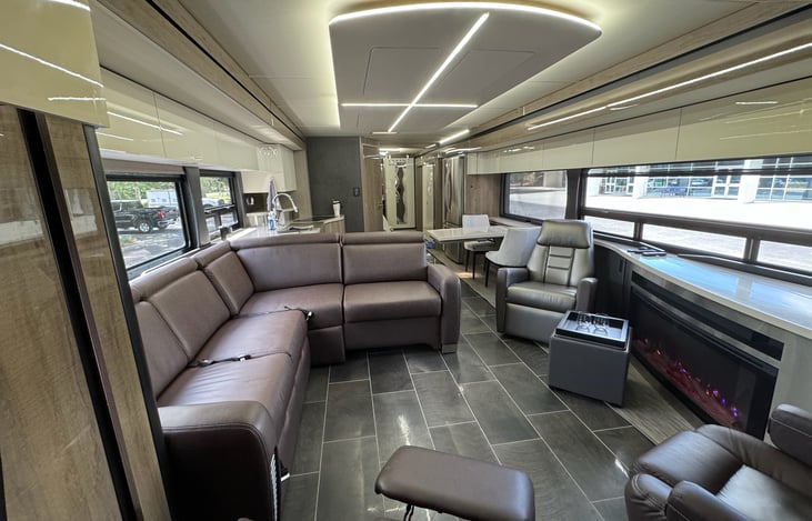 Two large, opposing slides extend to create a VERY spacious layout in the main living/eating area of this model.  There's a 3rd slideout for the main king sized bed.